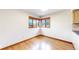 Dining area featuring hardwood floors and natural lighting, perfect for Gathering meals and gatherings at 23 Carla Way, Broomfield, CO 80020