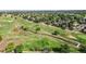 Aerial shot of a scenic golf course with rolling hills, trees, and walking paths at 23 Carla Way, Broomfield, CO 80020