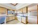 Kitchen featuring tile countertops, and appliances, offering functionality and style at 23 Carla Way, Broomfield, CO 80020