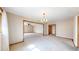 A spacious living room featuring neutral carpet, natural trim, and abundant natural light at 23 Carla Way, Broomfield, CO 80020