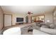 Cozy living room featuring neutral tones, a ceiling fan, and an open layout to the dining area at 23 Carla Way, Broomfield, CO 80020