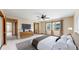 Bright main bedroom featuring a ceiling fan, ensuite bathroom and sunny windows at 23 Carla Way, Broomfield, CO 80020