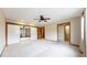 Main bedroom with a ceiling fan, ensuite bathroom, and sliding door closet at 23 Carla Way, Broomfield, CO 80020