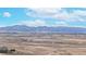 Expansive vista with snow-capped mountain range in the distance on a clear day at 23 Carla Way, Broomfield, CO 80020