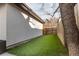 Artificial grass backyard with a wood fence along the perimeter at 1152 S Ogden St, Denver, CO 80210