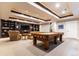 Finished basement features pool table, tv, recessed lighting and seating at 1152 S Ogden St, Denver, CO 80210