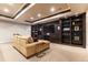 Cozy basement living room with plush seating, custom built-ins, and recessed lighting at 1152 S Ogden St, Denver, CO 80210