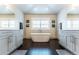 Chic bathroom with a soaking tub and dual vanity sinks providing a luxurious spa-like experience at 1152 S Ogden St, Denver, CO 80210