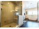 Luxurious bathroom featuring a freestanding tub and separate glass-enclosed shower at 1152 S Ogden St, Denver, CO 80210