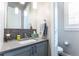 Modern powder bathroom featuring a stylish vanity and fixtures at 1152 S Ogden St, Denver, CO 80210