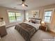 Bright bedroom with natural light from large windows and a ceiling fan at 1152 S Ogden St, Denver, CO 80210