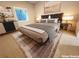 Bedroom features a large bed with side tables, an area rug, and natural light at 1152 S Ogden St, Denver, CO 80210