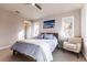 Cozy bedroom with a plush bed, stylish decor, and lots of natural light at 1152 S Ogden St, Denver, CO 80210
