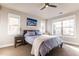 Bright bedroom featuring large windows, ceiling fan, and cozy decor at 1152 S Ogden St, Denver, CO 80210