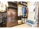 Walk-in closet with custom shelves and drawers providing ample storage space at 1152 S Ogden St, Denver, CO 80210