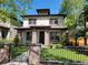 Charming two-story home featuring brick accents, a well-manicured lawn, and inviting curb appeal at 1152 S Ogden St, Denver, CO 80210