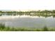 Scenic lake view with calm waters reflecting surrounding trees and buildings at 1152 S Ogden St, Denver, CO 80210
