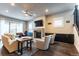 Comfortable living room with a fireplace, ceiling fan, and built-in cabinets at 1152 S Ogden St, Denver, CO 80210