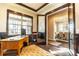 Cozy home office with natural light, a wooden desk, and sophisticated trim work at 1152 S Ogden St, Denver, CO 80210