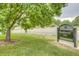 Lush green park entrance with a sign for Washington Park under a large tree at 1152 S Ogden St, Denver, CO 80210