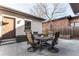 Outdoor patio area with a round table and seating for four at 1152 S Ogden St, Denver, CO 80210