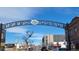 South Pearl Street entrance archway with shops and buildings on both sides at 1152 S Ogden St, Denver, CO 80210