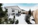 Backyard patio area with seating and fire pit, covered by snow at 20 Vista Canyon Dr, Castle Rock, CO 80104