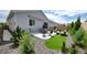 Inviting backyard featuring a patio with outdoor seating, a small patch of grass, and landscaping with small bushes at 20 Vista Canyon Dr, Castle Rock, CO 80104