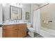 Well-lit bathroom featuring a wood vanity with light countertop and a shower-tub combination at 20 Vista Canyon Dr, Castle Rock, CO 80104