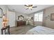 Bedroom with large dresser and closet, featuring wood-look floors at 20 Vista Canyon Dr, Castle Rock, CO 80104