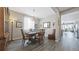 Elegant dining room with wood floors, a chandelier, and large window dressed with sheer curtains at 20 Vista Canyon Dr, Castle Rock, CO 80104