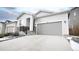 Charming curb appeal with gray garage and stone accents at 20 Vista Canyon Dr, Castle Rock, CO 80104