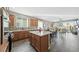 Open kitchen with quartz island, stainless steel appliances, view of dining and living area at 20 Vista Canyon Dr, Castle Rock, CO 80104