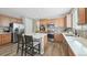 Bright open kitchen with modern stainless appliances, center island, and quartz countertops at 20 Vista Canyon Dr, Castle Rock, CO 80104