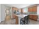 Bright open kitchen with modern stainless appliances, center island, quartz countertops at 20 Vista Canyon Dr, Castle Rock, CO 80104