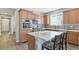 Bright open kitchen with modern stainless appliances, center island, quartz countertops at 20 Vista Canyon Dr, Castle Rock, CO 80104