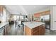 Kitchen view showcasing center island, stainless refrigerator, and open view of dining area at 20 Vista Canyon Dr, Castle Rock, CO 80104