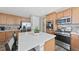 Kitchen with stainless steel appliances, center island, view of dining and living area at 20 Vista Canyon Dr, Castle Rock, CO 80104