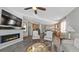 Inviting living room with fireplace and modern furnishings, seamlessly connected to the kitchen at 20 Vista Canyon Dr, Castle Rock, CO 80104