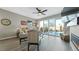 Bright open living room with hardwood floors, fireplace, and sliding glass doors to backyard at 20 Vista Canyon Dr, Castle Rock, CO 80104