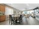 Living room with dining table, fireplace, and sliding glass doors to the backyard at 20 Vista Canyon Dr, Castle Rock, CO 80104
