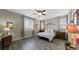 Cozy main bedroom features a ceiling fan and decor with plenty of natural light at 20 Vista Canyon Dr, Castle Rock, CO 80104