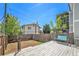 Backyard with a wooden deck, a swing, and a wooden fence at 5145 W 61St Dr # 14, Arvada, CO 80003