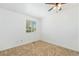 Bright bedroom features neutral carpet, a window, and plenty of wall space at 5145 W 61St Dr # 14, Arvada, CO 80003
