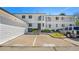 Townhome featuring reserved parking and welcoming entrance, with subtle landscaping in a vibrant neighborhood at 5145 W 61St Dr # 14, Arvada, CO 80003
