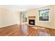 Open living space featuring a fireplace and sliding glass doors for natural light at 5145 W 61St Dr # 14, Arvada, CO 80003