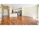Open floor plan showcasing the kitchen and living room with wood-look flooring at 5145 W 61St Dr # 14, Arvada, CO 80003