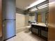 View of bathroom area featuring double sink vanity with mirror and shower at 8181 S Fillmore Cir, Centennial, CO 80122