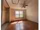 View of bedroom area with hard wood floors, ceiling fan and natural light at 8181 S Fillmore Cir, Centennial, CO 80122