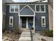 Charming townhome with a blue wood facade, decorative shutters, and well-maintained front entrance at 8181 S Fillmore Cir, Centennial, CO 80122